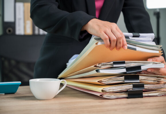 Close up Office employee working with documents at business desk in a business office