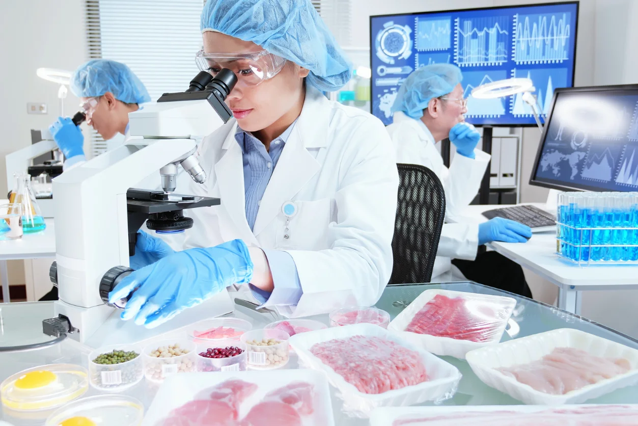 A Food Safety lab tech evaluates the food samples to comply with the Global Food Safety Initiative (GFSI).