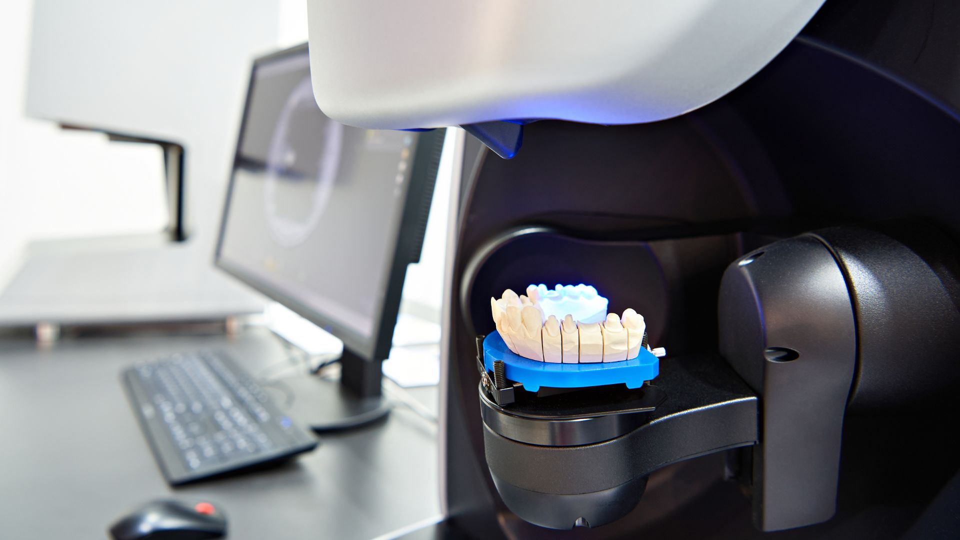 Dental Impression Materials are laid out on a digital scanner.