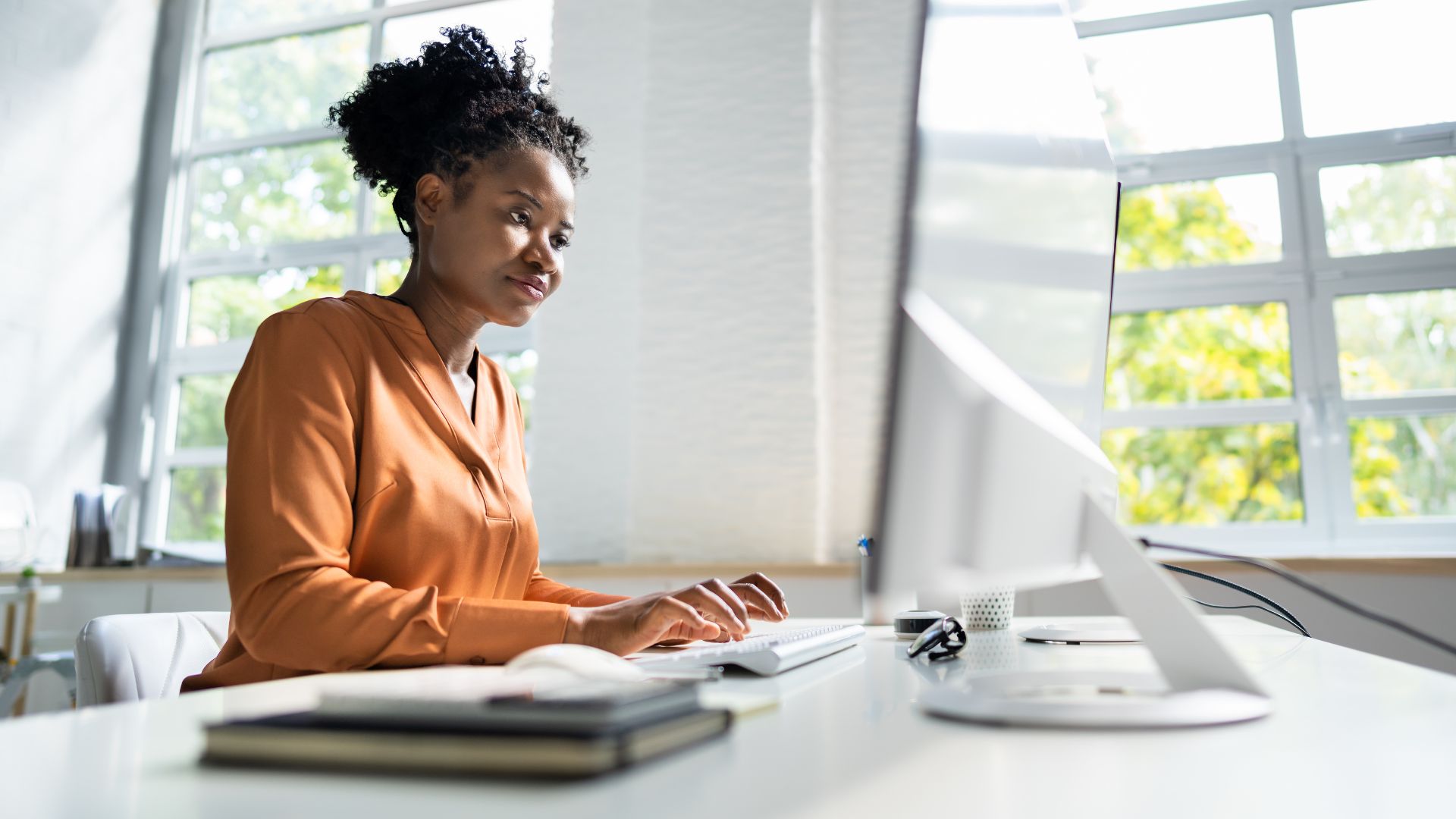 A young woman works online to get her food safety certifications.