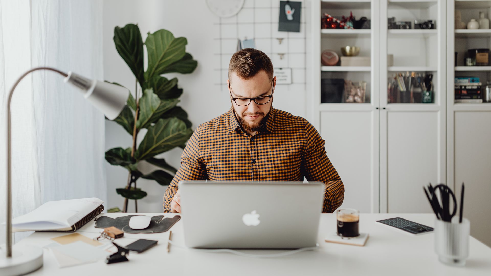 A man sits at his laptop seeking understanding about PCQI Training.