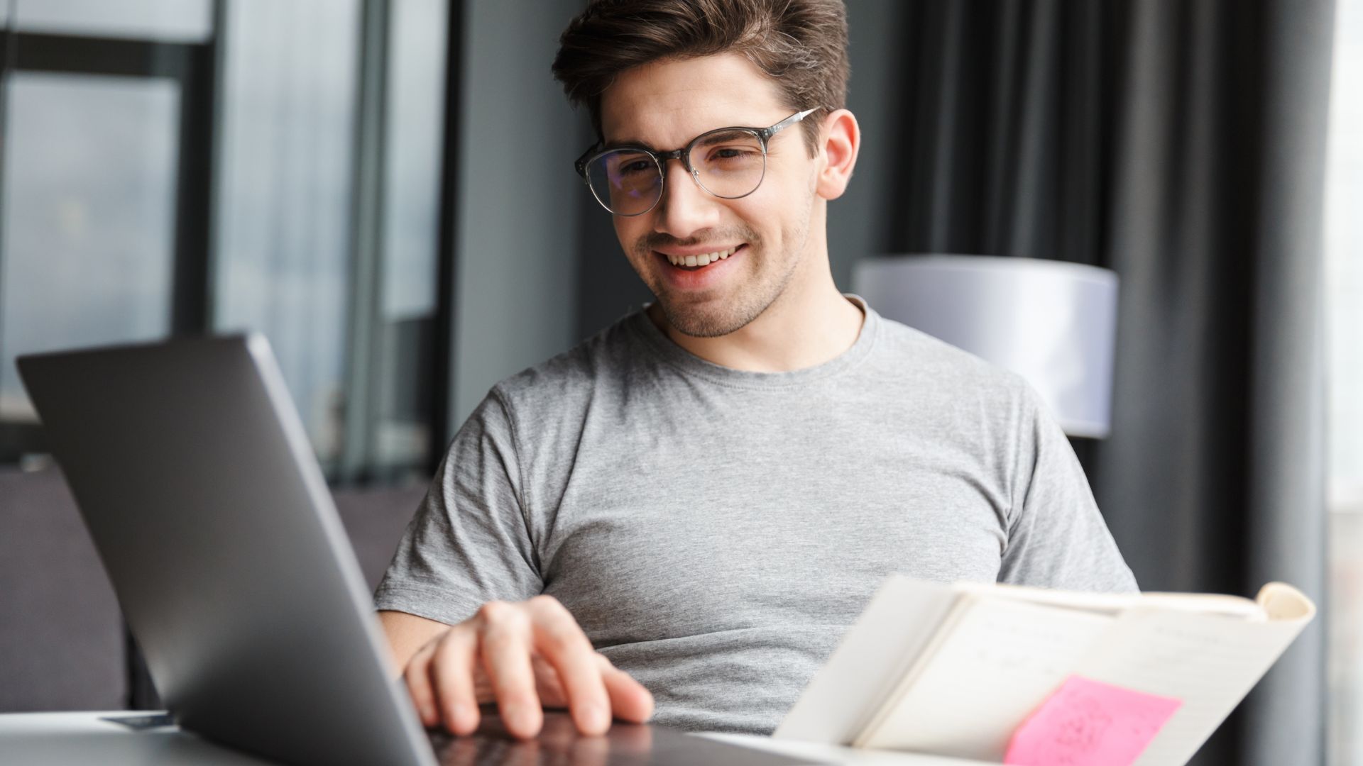 A man reviews the top 5 PCQI training courses on his laptop.