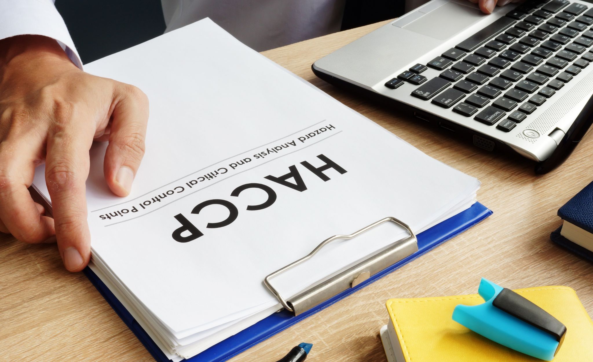 A food safety professional prepares his HACCP report as digital records.